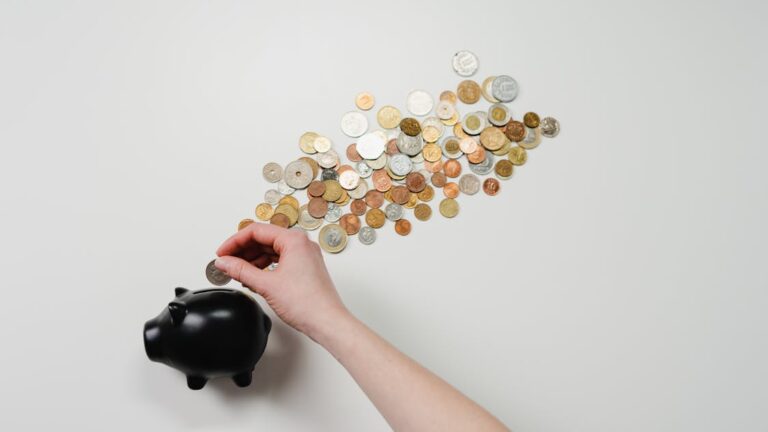 Piggy bank with coins representing emergency savings fund — financial safety net India